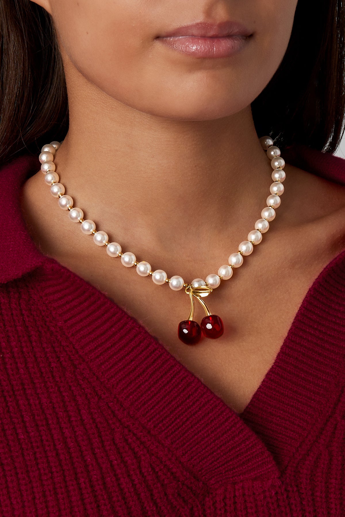 collier cerise sur le gâteau