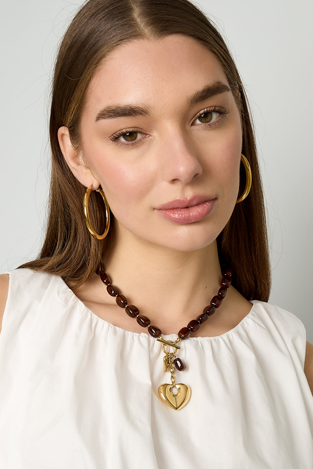 Collier de perles squovales avec pendentif cœur